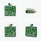 ツモリチサト 二つ折り財布 レディース ブランド tsumori chisato CARRY 財布 がま口 本革 革 大人 かわいい 二つ折 小銭入れ ミニ財布 牛革 日本製 エナメル グリッターフラワー がま口ミニ財布 57856
